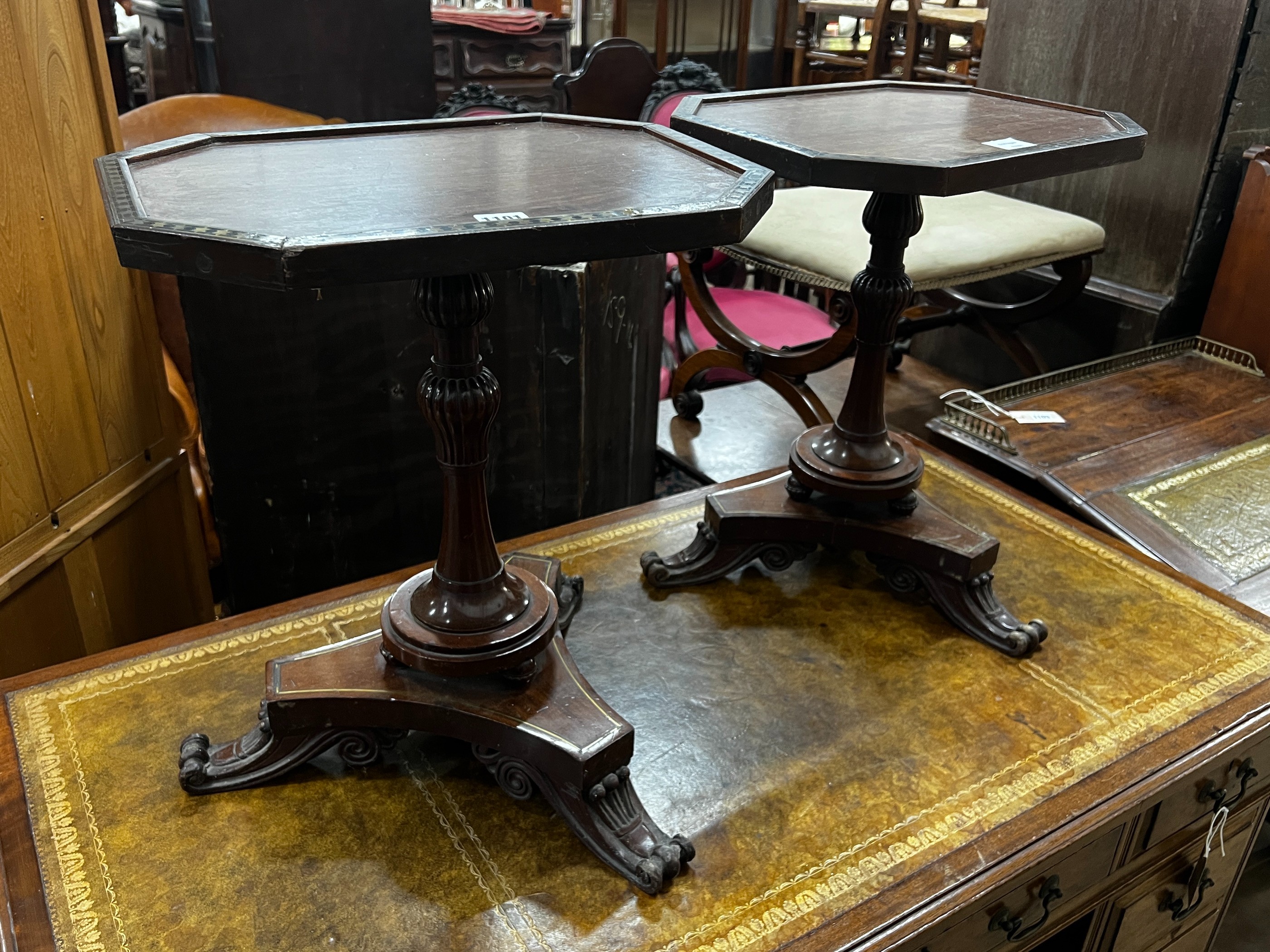 A pair of Regency style brass inlaid rosewood octagonal topped wine tables, width 43cm, depth 33cm, height 49cm